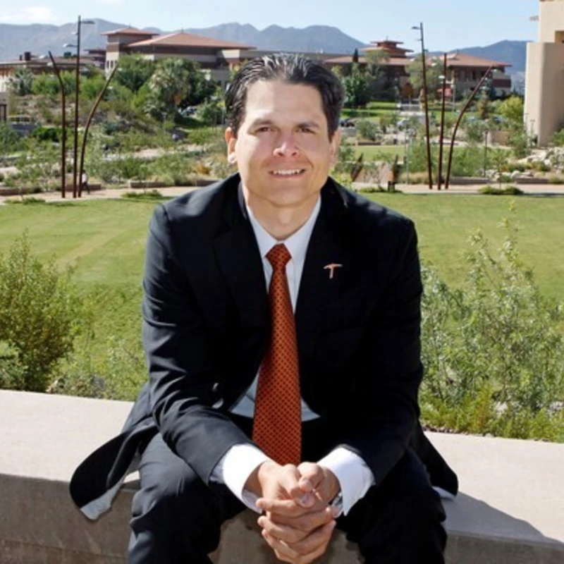 Archer Alumni Arturo Barrio sits on the UT El Paso campus